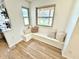 Cozy window seat with neutral pillows, hardwood floors, and natural light at 653 Southridge Ct, Westfield, IN 46074