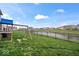 The backyard has a playground set, a fence, and has access to the canal in the back at 6536 W Shoreline Ct, Greenfield, IN 46140
