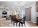 Open dining area featuring a wooden table, chairs, and seamless flow into the living room and kitchen, great for entertaining at 6536 W Shoreline Ct, Greenfield, IN 46140