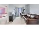 Comfortable living room that leads into a bedroom and features a couch and study area at 6536 W Shoreline Ct, Greenfield, IN 46140