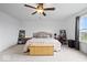 Spacious main bedroom with a ceiling fan, a cozy area rug, and two nightstands with lamps at 6536 W Shoreline Ct, Greenfield, IN 46140