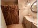 Bathroom featuring elegant vanity with marble countertop, decorative mirror and curtain at 6622 Stanley Rd, Camby, IN 46113