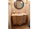 Bathroom showcasing vanity with marble countertop, decorative mirror and tiled floor at 6622 Stanley Rd, Camby, IN 46113