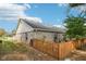Backyard with fenced in area and view of the home at 6853 Arjay Dr, Indianapolis, IN 46217