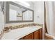 Modern bathroom featuring a large mirror, wood cabinets and mosaic tile backsplash at 6853 Arjay Dr, Indianapolis, IN 46217