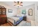 This bedroom features a white metal bed, hardwood floors, area rug, and neutral walls at 6853 Arjay Dr, Indianapolis, IN 46217