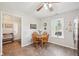 Cozy breakfast nook with wooden table, chairs, and natural light from window at 6853 Arjay Dr, Indianapolis, IN 46217