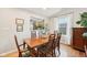 Elegant dining room with hardwood floors, view to the kitchen, and natural light at 6853 Arjay Dr, Indianapolis, IN 46217