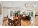 Spacious dining and living area with hardwood floors, fireplace, and ample seating at 6853 Arjay Dr, Indianapolis, IN 46217
