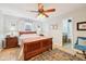 Comfortable main bedroom with hardwood floors, natural light, and an en-suite bathroom at 6853 Arjay Dr, Indianapolis, IN 46217
