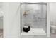 Modern bathroom features a glass enclosed shower with marble tiling and white base at 7007 Myra Way, Indianapolis, IN 46239