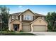 Charming two-story home featuring a brick and siding facade and a spacious three-car garage at 7007 Myra Way, Indianapolis, IN 46239