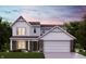 Charming two-story home featuring a brick and siding facade, inviting front porch, and attached two-car garage at 7125 Maidstone Cv, McCordsville, IN 46055