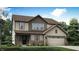 Charming two-story home with a brick foundation and an attached garage at 7236 Estes Dr, Indianapolis, IN 46239
