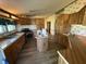 Spacious kitchen featuring wood cabinets, laminate countertops and flooring, and a kitchen island at 7765 N 225 W, Lebanon, IN 46052