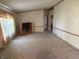 Cozy living room featuring carpet flooring, neutral paint, wood trim and a tv stand at 7765 N 225 W, Lebanon, IN 46052