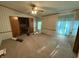 Spacious main bedroom featuring carpet flooring, neutral paint, wood trim, and a window at 7765 N 225 W, Lebanon, IN 46052