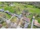 Aerial view of residential neighborhood and landscape including homes with mature trees and lush green spaces at 8051 Sycamore Springs Trl, Indianapolis, IN 46239
