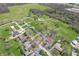 An aerial view of a home and property featuring large green spaces and mature trees in a residential area at 8051 Sycamore Springs Trl, Indianapolis, IN 46239
