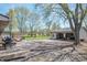Spacious backyard with garage, concrete patio, and lush green lawn great for outdoor activities at 8051 Sycamore Springs Trl, Indianapolis, IN 46239