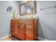 Bathroom featuring a wooden vanity, framed mirror, and neutral color scheme at 8051 Sycamore Springs Trl, Indianapolis, IN 46239