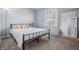Bright bedroom with natural light from the window and a full-length mirror at 8051 Sycamore Springs Trl, Indianapolis, IN 46239