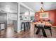 An open-concept dining room featuring a modern light fixture and stylish bar seating at 8051 Sycamore Springs Trl, Indianapolis, IN 46239