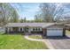 A charming home with a two-car garage and a sidewalk leading to the front door at 8051 Sycamore Springs Trl, Indianapolis, IN 46239