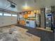 Attached garage features laundry area with washer, dryer, and storage cabinets for added convenience at 8051 Sycamore Springs Trl, Indianapolis, IN 46239