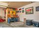 Finished garage space with sports memorabilia, seating, and a traditional dartboard at 8051 Sycamore Springs Trl, Indianapolis, IN 46239
