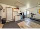 Finished interior garage with sink, cabinets, storage, and exercise equipment at 8051 Sycamore Springs Trl, Indianapolis, IN 46239