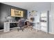 A modern home office with two desks and neutral color palette with a large banner on the wall at 8051 Sycamore Springs Trl, Indianapolis, IN 46239
