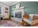 A living room with a decorative fireplace, and cozy seating area providing a warm and inviting atmosphere at 8051 Sycamore Springs Trl, Indianapolis, IN 46239