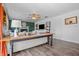 The living room features a ceiling fan, hardwood floors, stylish furniture, and cozy fireplace at 8051 Sycamore Springs Trl, Indianapolis, IN 46239