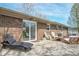 Brick house patio with outdoor seating area perfect for enjoying beautiful days at 8051 Sycamore Springs Trl, Indianapolis, IN 46239