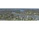Expansive aerial view of lakefront homes with private docks and tennis courts nestled in a vibrant community at 8069 Middle Bay Ln, Indianapolis, IN 46236