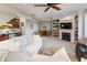 Finished basement with a cozy seating area, wet bar, fireplace, and built-in shelves for storage at 8069 Middle Bay Ln, Indianapolis, IN 46236