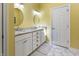 Bright bathroom with double sink vanity, marble countertop, and white cabinets at 8069 Middle Bay Ln, Indianapolis, IN 46236