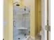 Bathroom showcasing a modern glass-enclosed shower with marble-style tile at 8069 Middle Bay Ln, Indianapolis, IN 46236