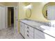 Bright bathroom with double sink vanity, marble countertop, and modern fixtures at 8069 Middle Bay Ln, Indianapolis, IN 46236