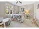 Comfortable bedroom with a ceiling fan, natural light, and a serene atmosphere at 8069 Middle Bay Ln, Indianapolis, IN 46236