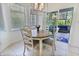 Cozy breakfast nook with views of the screened-in porch, perfect for casual dining at 8069 Middle Bay Ln, Indianapolis, IN 46236
