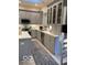 Beautiful kitchen features gray cabinets, stainless steel appliances, and an island at 8069 Middle Bay Ln, Indianapolis, IN 46236