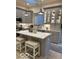 Well-appointed kitchen with gray cabinets, stainless steel appliances, and center island at 8069 Middle Bay Ln, Indianapolis, IN 46236