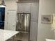 Modern kitchen features stainless steel refrigerator and ample cabinet space at 8069 Middle Bay Ln, Indianapolis, IN 46236