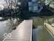 Dock and lake view, with the surrounding buildings adding to the serene waterfront setting at 8069 Middle Bay Ln, Indianapolis, IN 46236