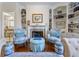 Cozy living room features built-in bookshelves, fireplace, and hardwood floors at 8069 Middle Bay Ln, Indianapolis, IN 46236