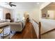 Bright and airy living room featuring hardwood floors, comfortable sofas, and a view of the staircase at 8069 Middle Bay Ln, Indianapolis, IN 46236