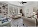 Bright living room with hardwood floors, large windows, and comfortable seating arrangement at 8069 Middle Bay Ln, Indianapolis, IN 46236