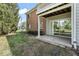 A sliding glass door opens to the backyard patio on this brick two-story building at 8216 Glenwillow Ln # 104, Indianapolis, IN 46278